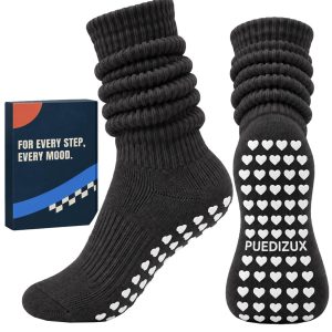 Puedizux review image: black studio socks with white grip dots. Product facts unverified.